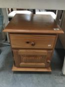 A pine bedside cabinet