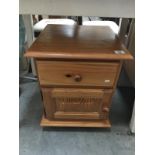 A pine bedside cabinet