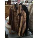2 fur coats (1 faux)