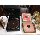 A HMV picnic gramaphone with a quantity of 78rpm records
