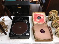 A HMV picnic gramaphone with a quantity of 78rpm records