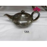A Georgian silver teapot, hall marked London 1828/29, Crespin Fuller., 14.25 ounces.