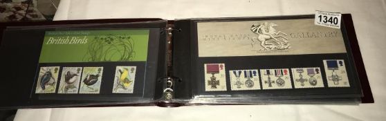 An album of 24 mint Gb presentation packs, 1960's onwards.