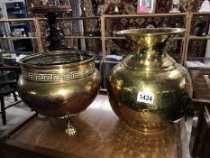 A brass jardiniere and a brass vase.