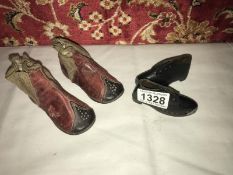 A pair of 19th century children's shoes and a pair of traveller's sample shoes.