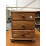 A solid pine 3 drawer chest of drawers