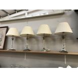 4 table lamps with glass columns and metal bases