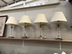 4 table lamps with glass columns and metal bases