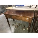 A mahogany fold over table.