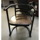 A dark wood stained Bentwood carver chair