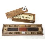 A set of dominoes with cribbage board