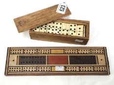 A set of dominoes with cribbage board