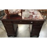 A modern leather top twin pedestal desk