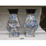 A pair of Losol Cavendish blue, white and gold vases.