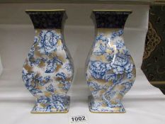 A pair of Losol Cavendish blue, white and gold vases.