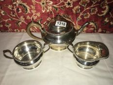 A 3 piece silver tea set, London 1930-31, approximately 37.5 oz.