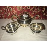 A 3 piece silver tea set, London 1930-31, approximately 37.5 oz.