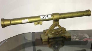 A brass optical instrument sight