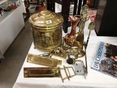 A brass coal scuttle & companion set including door furniture & copper jug etc.