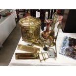 A brass coal scuttle & companion set including door furniture & copper jug etc.