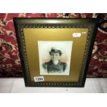 A painting over photo on milk glass portrait of a lady featuring Union Jack on hat ribbon.