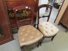 A pair of mahogany chairs.