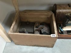 A painted pine box with tools including woodworking