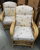 A pair of bamboo conservatory chairs