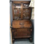 A carved wood bookcase bureau