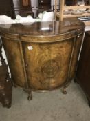 A domed front cabinet.