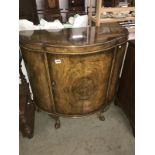 A domed front cabinet.