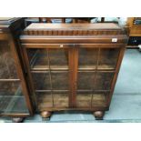 A 1930's/40's glass panel fronted display case/bookcase