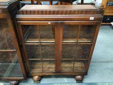 A 1930's/40's glass panel fronted display case/bookcase