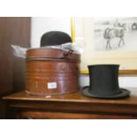 A collapsible top hat in vintage tin case and a Dunn & Co., bowler hat.