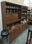 A pair of modern wall units (1 with drinks cabinet) both on casters