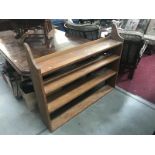 An Edwardian oak wall book rack.