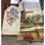 An embroidered chair back cover and a small Dutch windmill scene tapestry.
