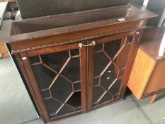 An Edwardian mahogany astragal glazed dresser top.