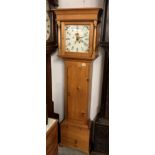 A pine cased 30 hours long case clock with square painted dial.