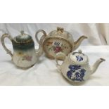 A Sadler blue and white teapot, a Sadler floral teapot and a 19th century floral teapot.