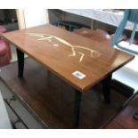 A mahogany coffee table with painted top.