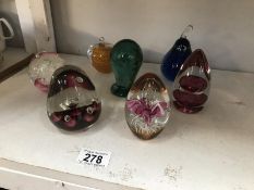 7 glass paperweights including a Wedgwood.