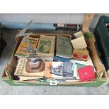 A box of Scouts and scouting memorabilia and books.