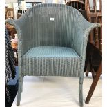 A blue Lloyd loom chair.