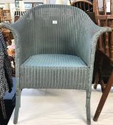 A blue Lloyd loom chair.