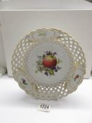 A continental porcelain ribbon fruit bowl with crossed swords makers mark.
