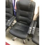 A black leather office chair.