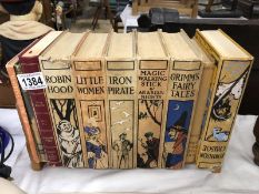 A book stand and books including Robinson Cruseo, Robin Hood etc.