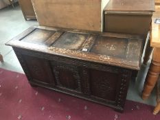 An early 20th century carved oak coffer.