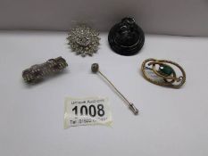 A Victorian brooch, 2 other brooches, a French jet brooch and a stick pin.